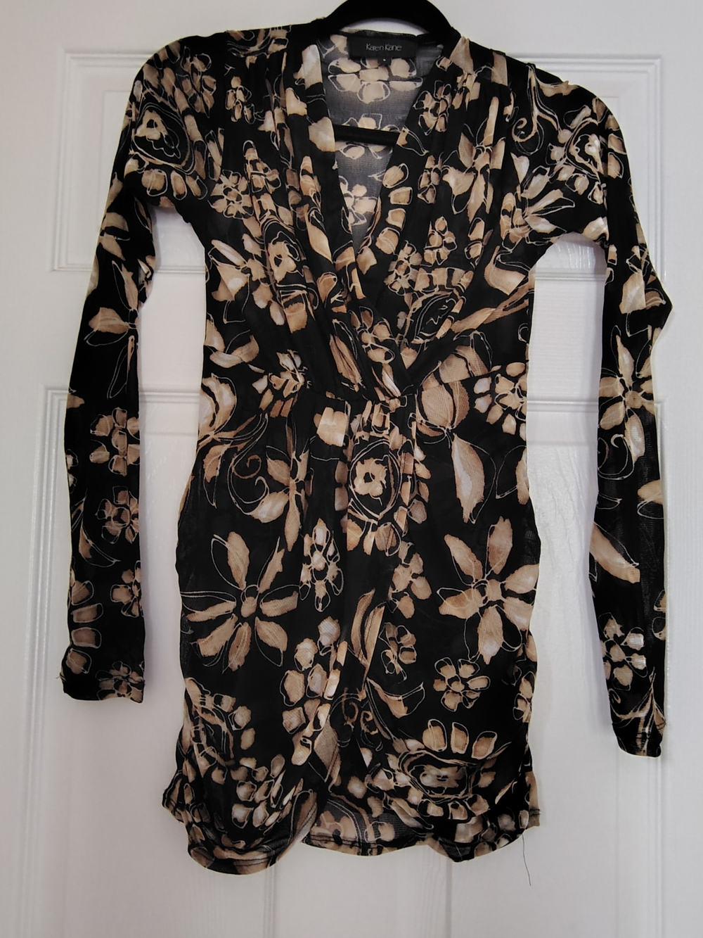 Karen Kane Black and Cream Floral Wrap-Style Tunic Top